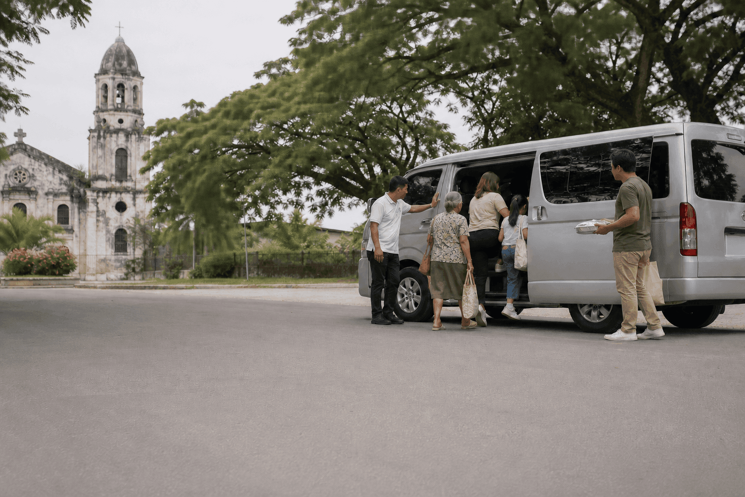 A family loading into a private van with their driver on a Pampanga side street