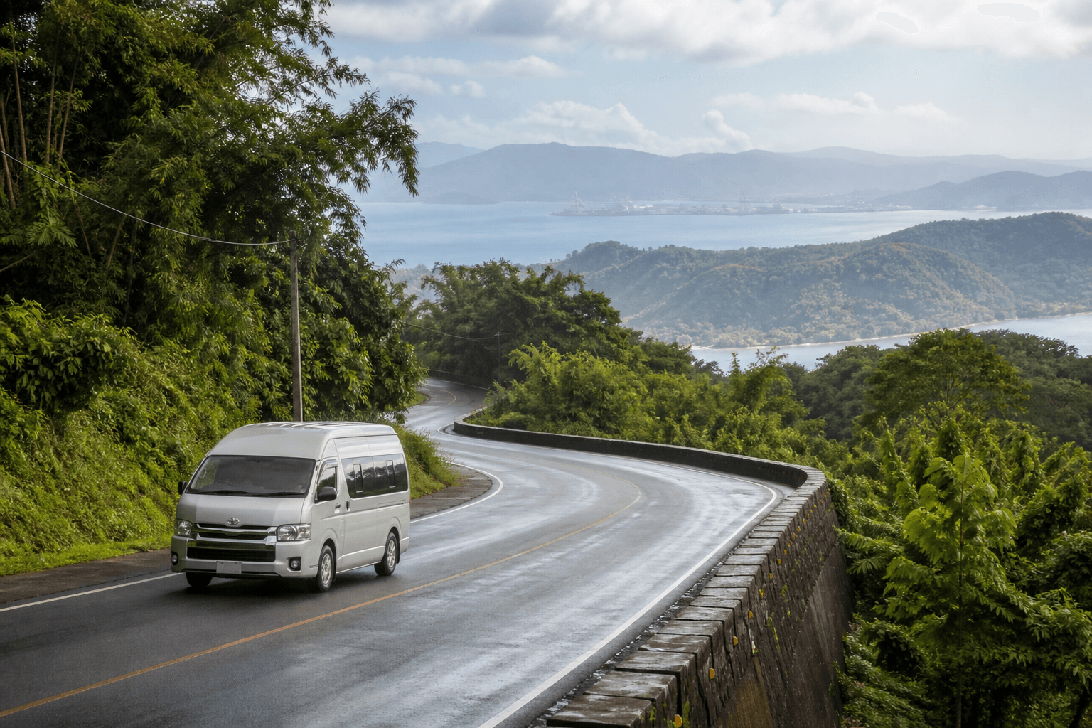 Private van on a scenic road towards Subic